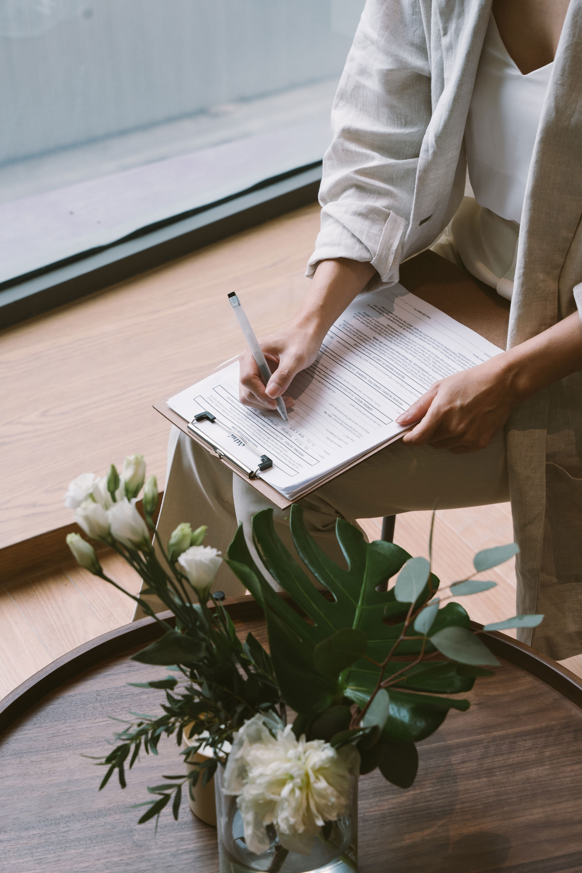 Woman is writing a consultation note.